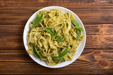 Pasta tagliatelle with green sauce pesto
