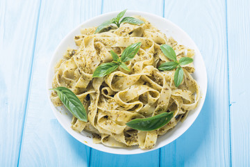 Pasta tagliatelle with green sauce pesto