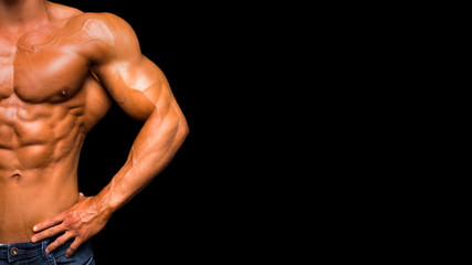 Closeup torso of shirtless muscular man posing on a black background