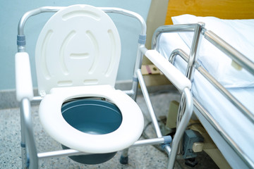 Commode chair or mobile toilet can moving in bedroom or everywhere for elderly old people or patient : healthy strong medical concept 