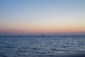 Fototapeta premium Evening landscape at sunset on the sea