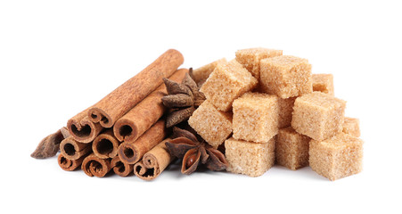cane sugar and cinnamon isolated on white background