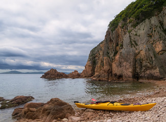 Sea kayak on the sea coast.