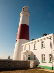 white and red large lighthouse isle of portland weymouth building summer