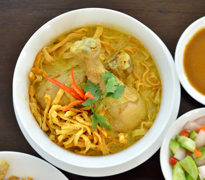 Egg noodle in chicken curry soup (Kao Soi Kai ), Thai Northern style food.