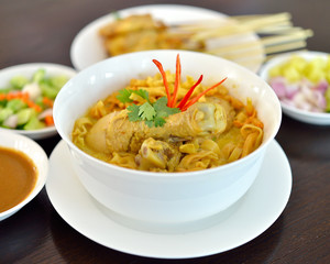 Egg noodle in chicken curry soup (Kao Soi Kai ), Thai Northern style food.