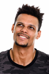 Obraz premium Face of young happy African man smiling while thinking and looki