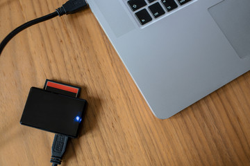 Laptop and card reader on the table