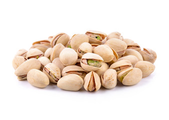 Pistachio nuts on a white background.