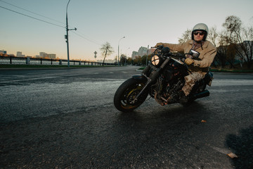 young man on a motorcycle is turning