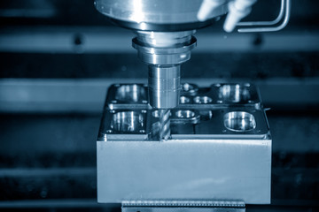 The CNC milling machine cutting the forging mold part by solid radius end mill tool.Mold manufacturing process.