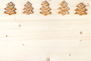 christmas homemade gingerbread cookies on wooden background with empty copy space for text. snowflake and star shapes. holiday, celebration and cooking concept. new year and christmas frame