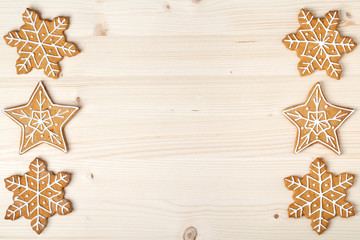 christmas homemade gingerbread cookies on wooden background with empty copy space for text....