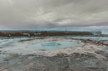 Strokkur (churn) fountain geyser in the geothermal area beside the Hvítá River. Haukadalur, Geysir - Iceland
