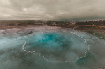 Strokkur (churn) fountain geyser in the geothermal area beside the Hvítá River. Haukadalur, Geysir - Iceland