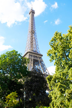 Eiffel Tower in Paris on a bright sunny day, France.