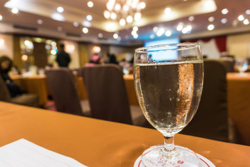 Water glass on table of seminar room