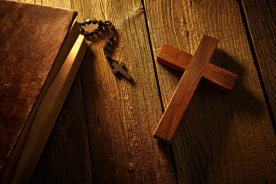 Christian cross on wood bible and rosary