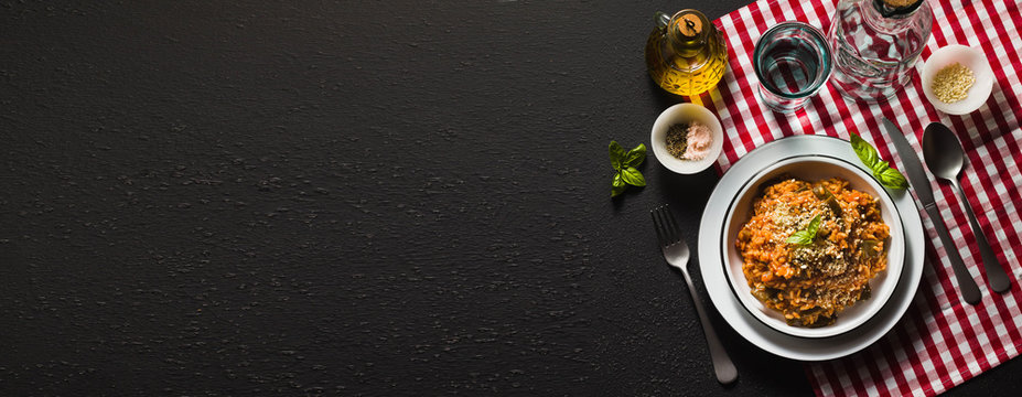 banner of Italian risotto with tomato sauce on the table. copy space