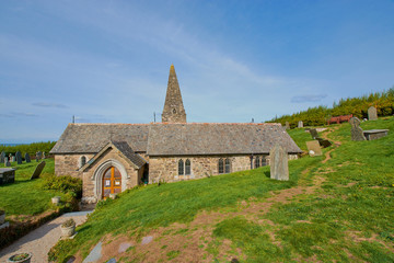 Fototapeta na wymiar The 12th century St Enodoc Church Trebetherick, is the resting place of Poet Laureate Sir John Betjeman. Cornwall England
