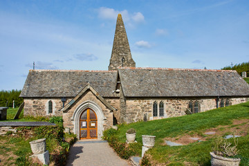 Fototapeta na wymiar The 12th century St Enodoc Church Trebetherick, is the resting place of Poet Laureate Sir John Betjeman. Cornwall England