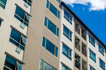 Modern condominium building real etate in city with blue sky