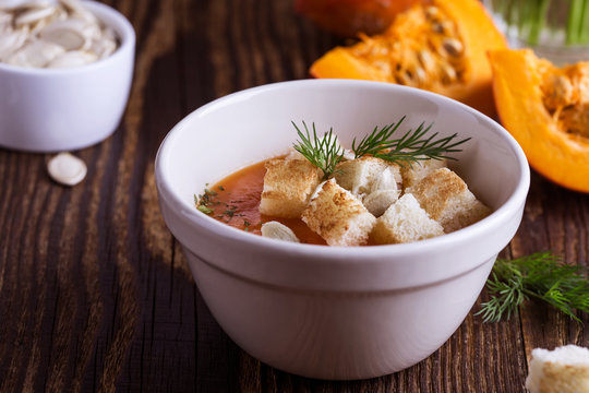 Butternut squash soup  in bowl topped with croutons