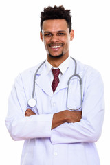 Fototapeta premium Young happy African man doctor smiling with arms crossed