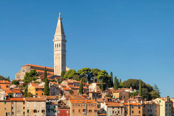 Fototapeta na wymiar Tall church dominates Venetian old town, Rovinj, Istria peninsula, Croatia