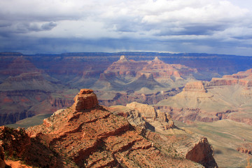 Grand Canyon aerial view. Beautiful nature landscape with cloudy sky over the amazing relief structures in the Grand Canyon National Park, Arizona, USA. Scenic aerial view from south rim.