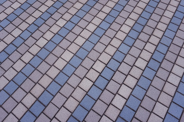 outdoor multi-colored floor tiles. multi-colored tiles from which a pedestrian road in the park is made, details and a close-up of the infrastructure in the city