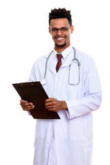 Young happy African man doctor smiling while holding clipboard