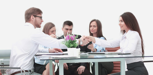 handshake of business partners on a Desk in the office