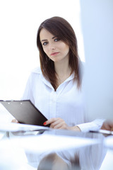 portrait of modern business woman with documents.