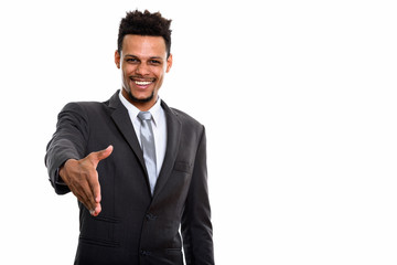 Young happy African businessman smiling while giving handshake
