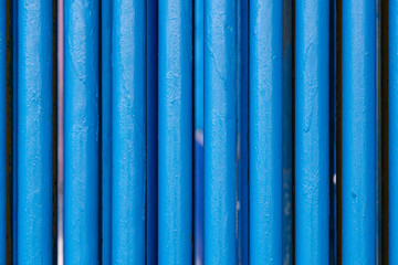 Many old blue pipes. Pipeline used in different industry ways: gas, water or vapor supply. Close up
