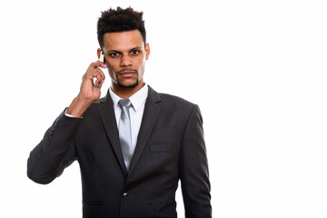 Young African businessman talking on mobile phone