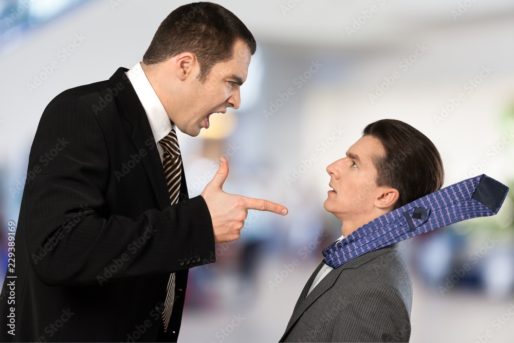 Wall mural businessman shouting orders at a worker