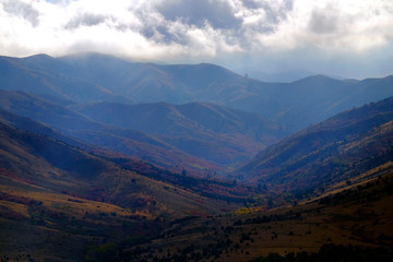 Fall Autumn Canyon and Mountains with Cloud Stormy Clouds