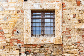 Fototapeta na wymiar Window with bars on a wall