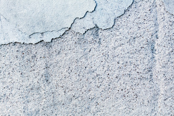 The gray old wall. Cracked concrete. Close-up