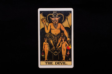 An individual major arcana tarot card isolated on black background. The Devil. - obrazy, fototapety, plakaty