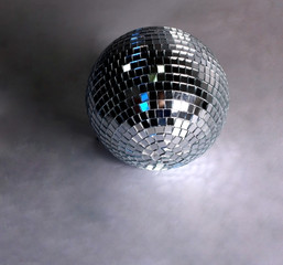 beautiful disco ball on yellow background isolated.
