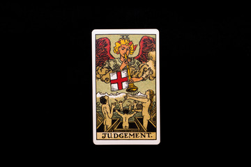 An individual major arcana tarot card isolated on black background. Judgement.