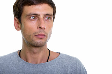 Obraz premium Close up of young handsome man thinking while looking at distanc