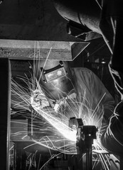 worker with protective mask welding metal, Black&White