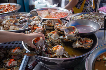 Street Food in Chinatown with Seafood include crap shrimp with egg on pickle  