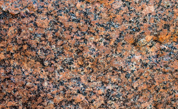 A part of marble tile with a black-and-red rattern
