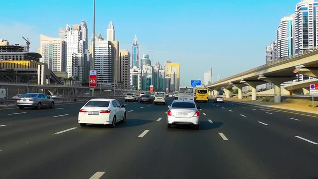 Beautiful view of sheikh Zayed road in Dubai city - Drive by modern skyscrapers and towers