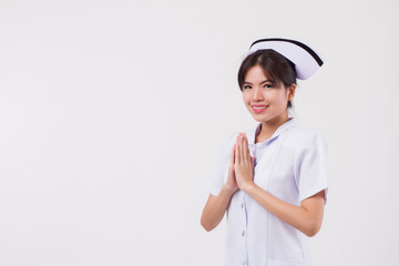 friendly smiling female nurse with Asian Thai style welcoming gesture
